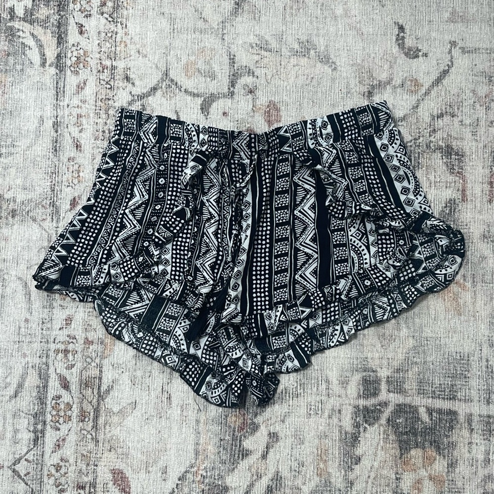 Ocean Drive-Black and white tribal print shorts with tie waistband & ruffle hem